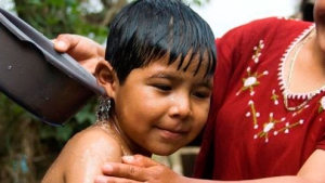 Boy enjoying water in Guatemala - April