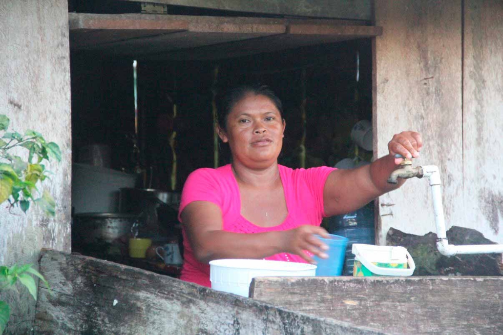 Woman with tap in Colombia